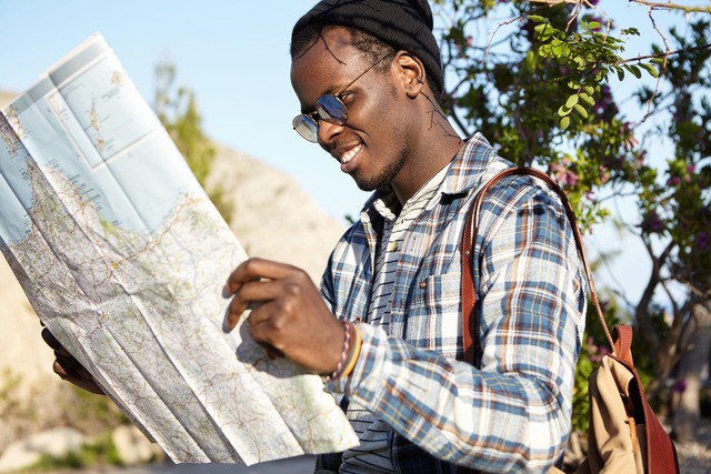 active-lifestyle-travel-tourism-cheerful-fashionable-young-dark-skinned-traveler-with-backpack-holding-map-feeling-excited-about-road-trip-mountain-area-standing-nature-surroundings (1) (1) (1) (1)